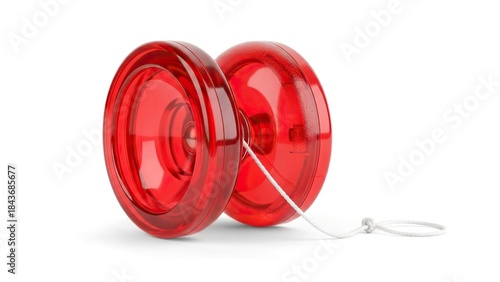 A red translucent yoyo with a white string is on a white surface
