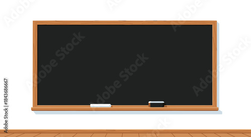 Empty black chalkboard with a wooden frame hanging on a classroom wall with chalk and an eraser, ready for a lesson.