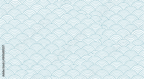 Seigaiha wave pattern fills the background with soft blue arches creating a calm decorative texture reminiscent of traditional ocean inspired design.