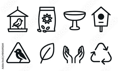 Ecology icons: birdhouses, bird feeders, and recycling symbols on dark background