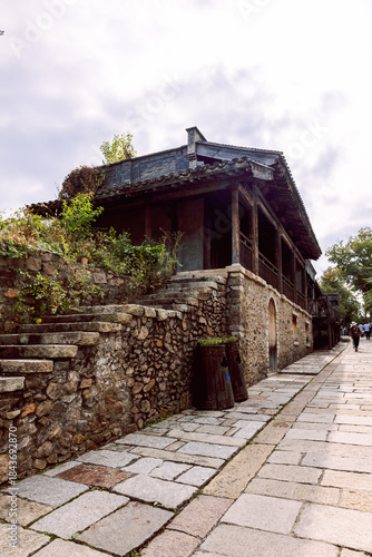 Gubei Water Town stone gate tower in China. Vertical photo