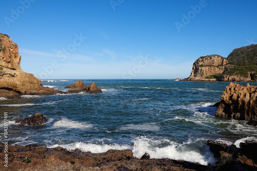 The Rocky Outcrops At Knysna Heads River Inlet Overlooking An Open Ocean Horizon, South Africa