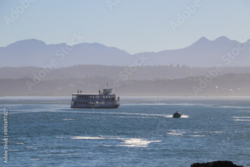 Small Boat And Ferry On The Knysna River Inlet Lagoon With Distant Mountain Horizon, South Africa