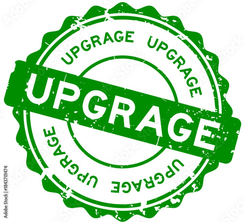 Grunge green upgrade word round rubber seal stamp on white background
