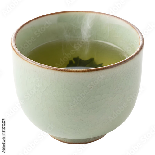 Light Green Ceramic Tea Cup Filled With Steaming Green Tea And A Single Leaf