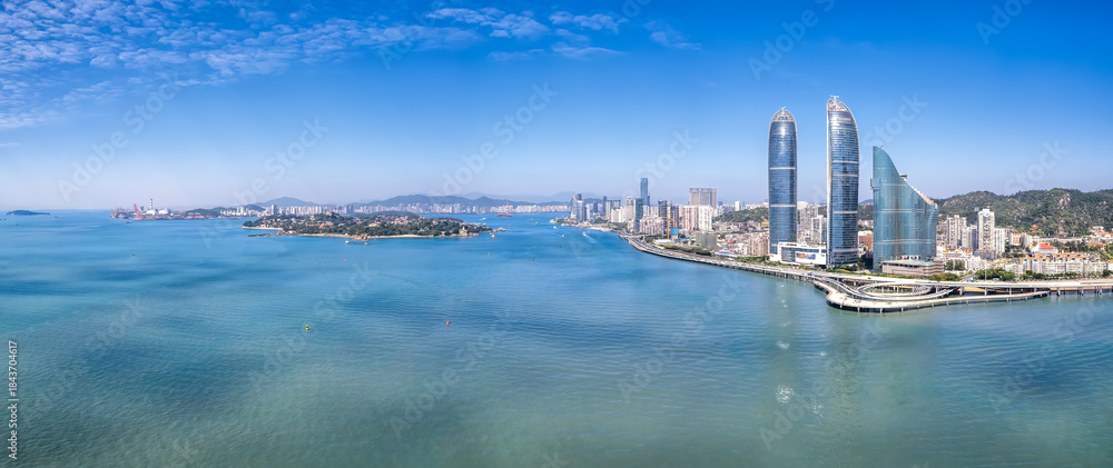 Fototapeta premium Aerial View of Coastal Cityscape with Skyscrapers