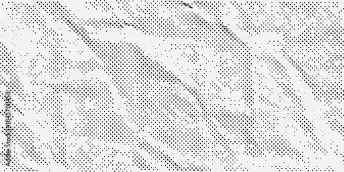 Abstract monochrome texture with diagonal lines and grainy speckled pattern