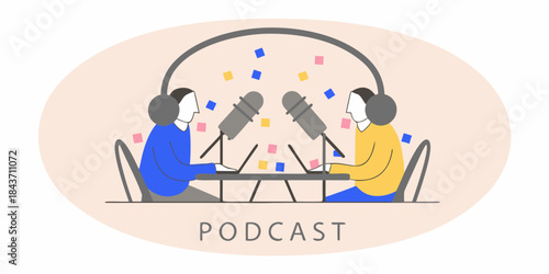 Two people recording a podcast with microphones and a table