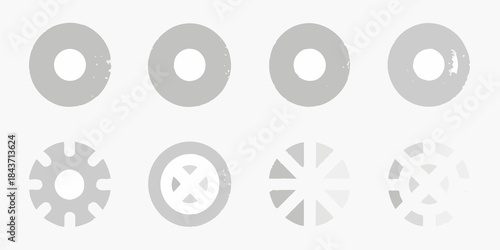 A collection of gray circular shapes with varying central designs and patterns