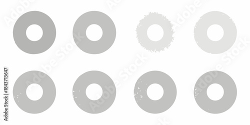 A series of gray circular shapes with varying textures and densities