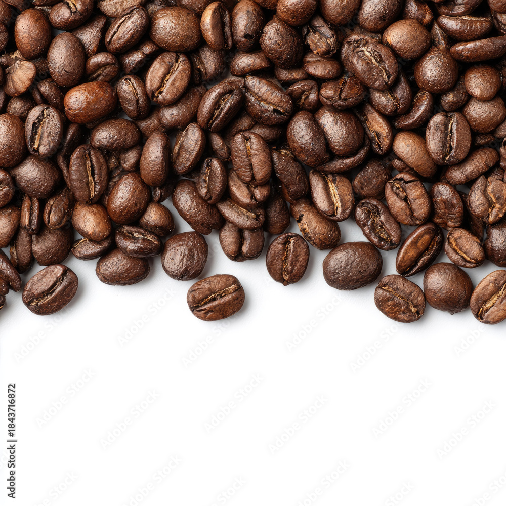 Naklejka premium Roasted coffee beans close up with rich brown color white