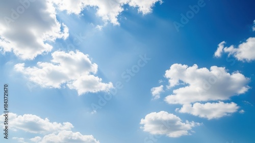 Bright blue sky filled with fluffy white cumulus clouds