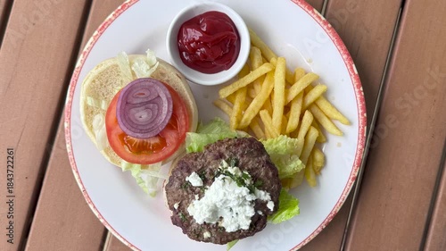 Delicious Hamburger with Feta Cheese and French Fries