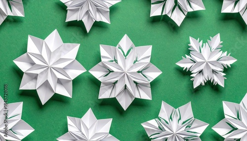 Wallpaper Mural White origami snowflakes arranged in a pattern on a green background. Torontodigital.ca