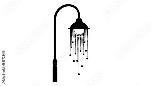 Silhouette of a vintage street lamp with stylized light beams