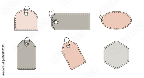 Assorted leather travel tags in soft pastel colors with stitched edges and metal rings shown in rounded rectangular oval tags and polygonal shapes.