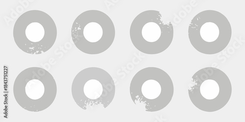 A pattern of gray donut shapes arranged in a grid formation