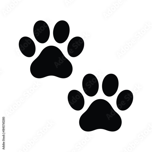 Simple black and white illustration of two animal paw prints shown closely