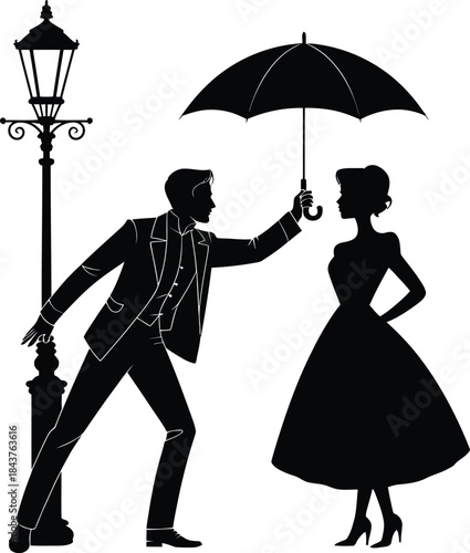 Man holding umbrella over woman silhouette by lamppost