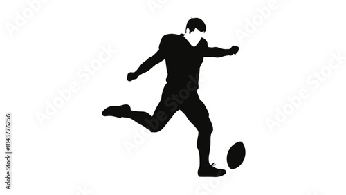 Silhouette of Gridiron Action: A dynamic silhouette captures the moment of a powerful kick during an American football game. Demonstrating skill, strength and precision