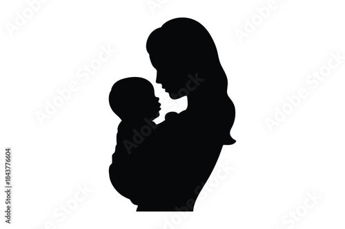 A tender moment captured in silhouette: a mother lovingly holding her baby