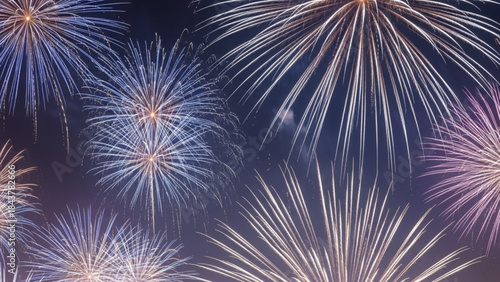 Vibrant fireworks exploding in the night sky with colorful bursts