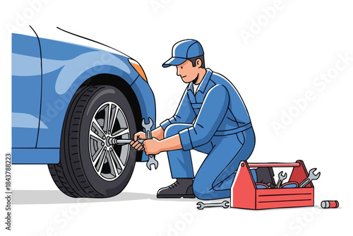 Mechanic in blue coveralls changing a car tire, tools and toolbox present