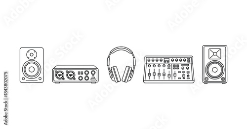 Audio equipment lineup with mixer, headphones, speakers and interface
