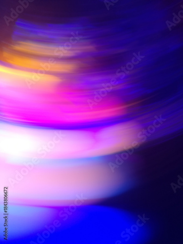 Soft cosmic light streams stretch across deep space in vertical motion.