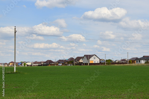 Suburban Housing Development and Green Field Landscape
