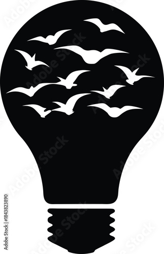 Creative lightbulb image with many birds flying inside symbolizing freedom and thought