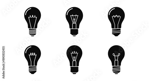Collection of silhouette light bulb icons in black and white set against a white background