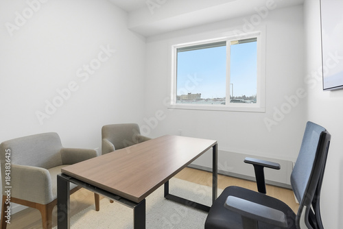 Small office with a desk and two chairs