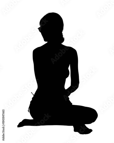 Woman in swimwear stretching outdoors on a sunny day.