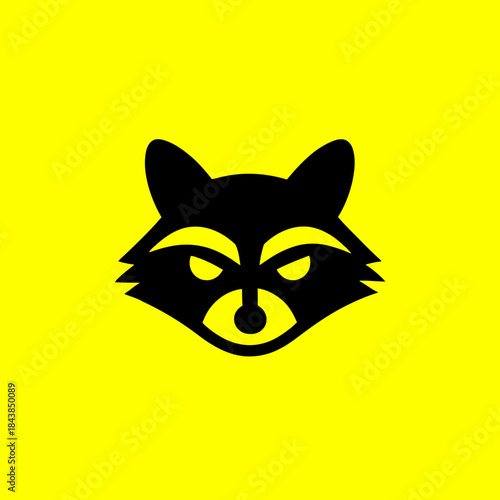 Stylized black raccoon head silhouette vector icon on a vibrant yellow background, representing a wild animal or mascot design.