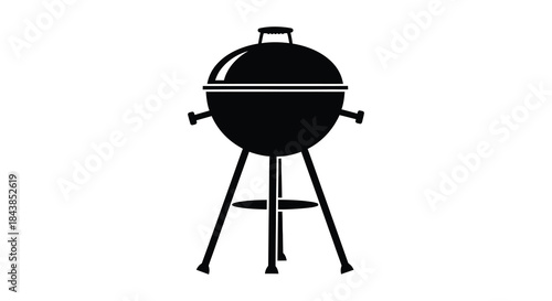 A sleek black barbecue grill stands prominently displayed showcasing a classic design silhouette