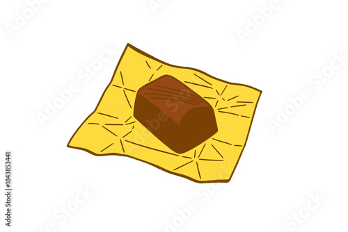 Unwrapped chocolate candy bar resting on gold foil