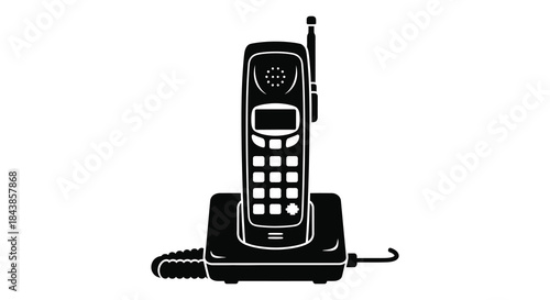 A black and white depiction of a vintage cordless telephone on its base silhouette