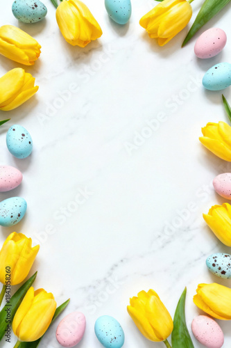vibrant yellow tulips and pastel easter eggs form a festive border on a marbled background