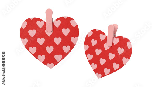Two textured red hearts with pink heart pattern, held by pink clothespins, romantic decoration for Valentine's Day, isolated element for greeting card design