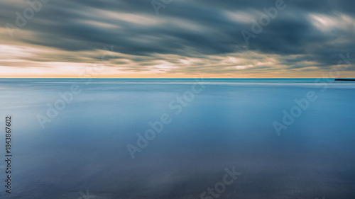 Fototapeta Naklejka Na Ścianę i Meble -  summer sunrise over the lagoon meets the sea, Bibione Pineda, Venice, Italy