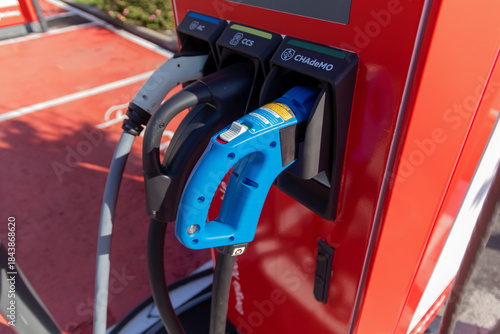 Wallpaper Mural Modern electric vehicle charging station in an urban parking area, highlighting clean energy, sustainable transport, green technology, and eco friendly mobility. Torontodigital.ca