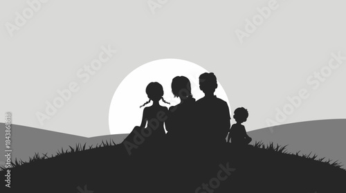 Silhouette of a family of four, including parents and two children, sitting on a hill enjoying the sunset or sunrise.