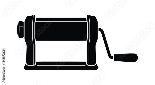 A striking black silhouette of a vintage manual pasta machine showcasing its classic design silhouette