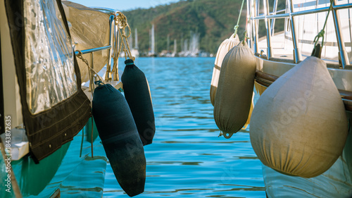 Canvas Print Boats moored side by side with fenders in marina