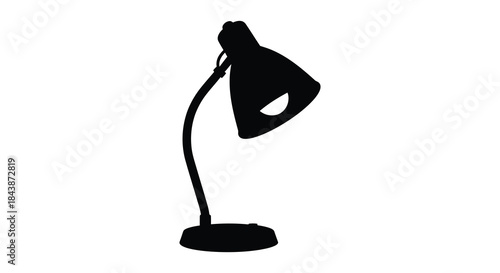 A striking black desk lamp presented in a bold contrasting silhouette