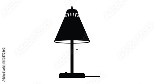 A striking black lamp stands prominently displayed against a pure white background silhouette