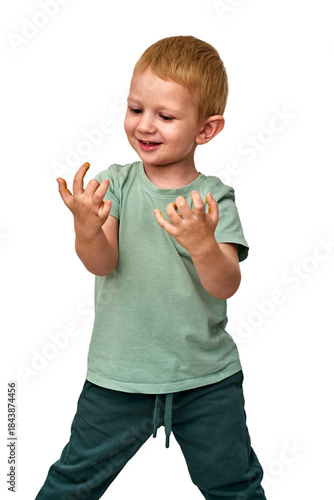 Smiling Toddler Standing and Looking at Hands Isolated on White Background