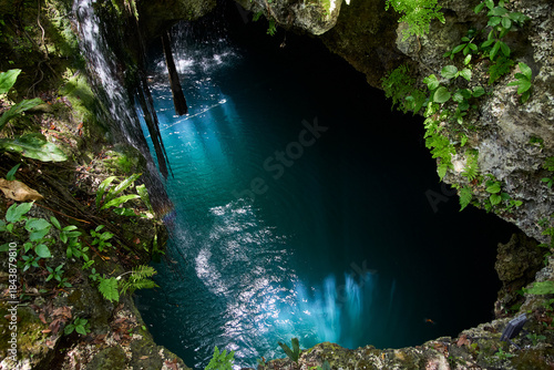 water flowing into the water, cenote, forest, Yucatan Mexico