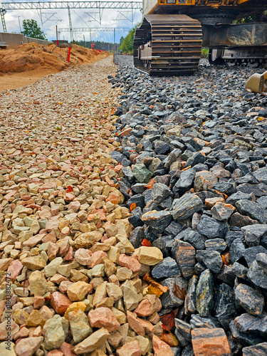 Part of the road construction site with a large number of stones.